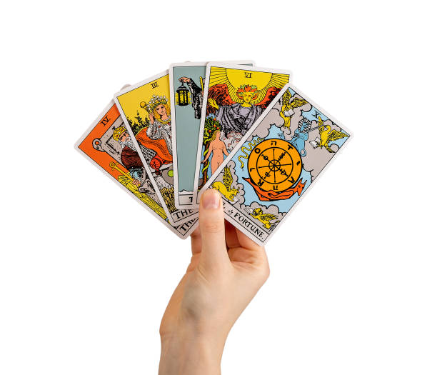 hand holding tarot cards, major arcana isolated on white background. hand holding tarot cards, major arcana isolated on white background.